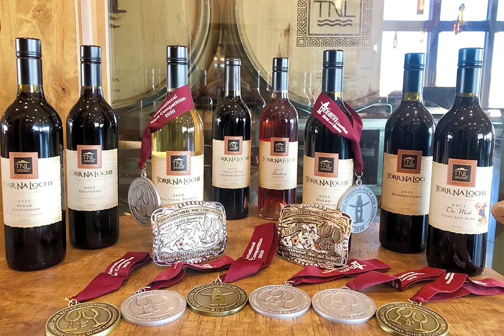 Torr Na Lochs wine with glasses and awards